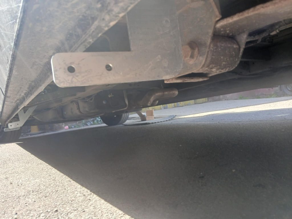 Bracket fixed under Vauxhall Movano chassis during side bar fitting