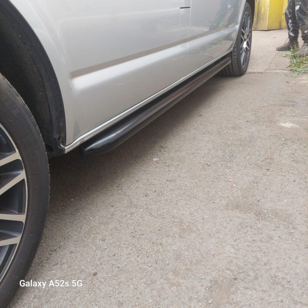 VW T6.1 side bar installation with sleek black bar fitted under side panel