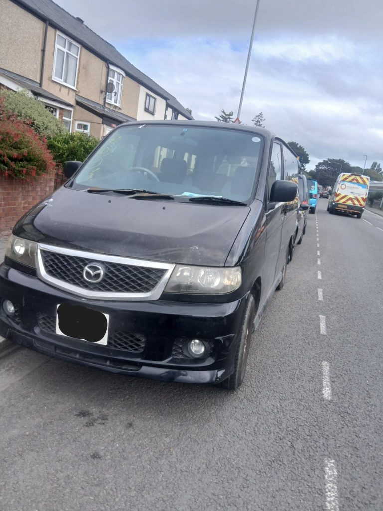 Front view of a Mazda Bongo campervan parked outside after restoration, showing clean bodywork and modern respray.