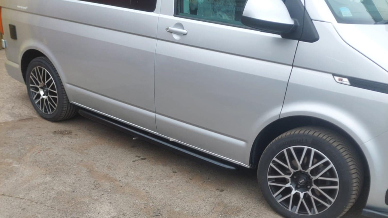Completed VW T6.1 side bar installation with black bars enhancing exterior look