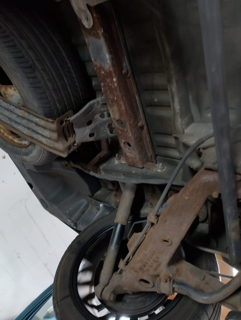 VW T6 underbody showing surface rust before full underseal treatment by Kinmel Campers