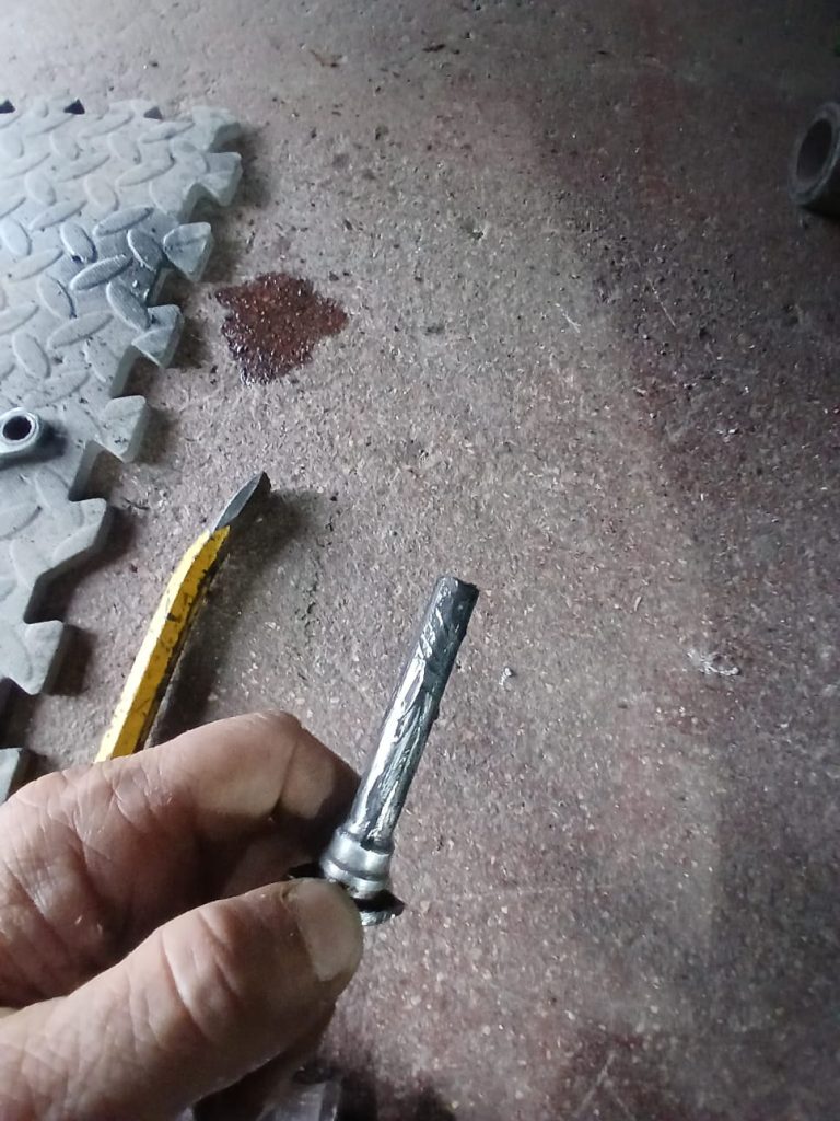 Seized caliper bolt removed during VW T6 service and underseal repair at Kinmel Campers