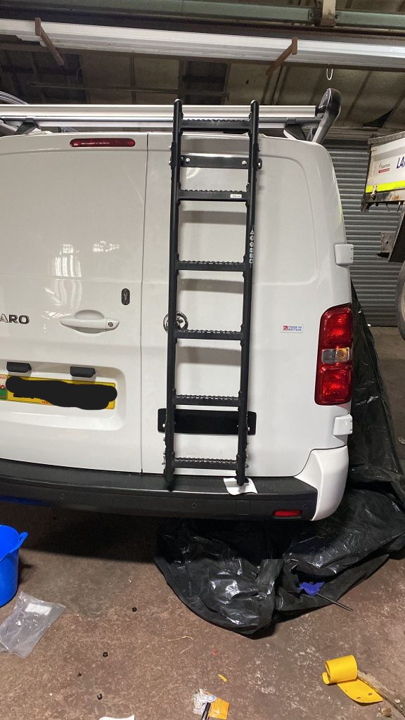 Heavy-duty rear ladder fitted for roof access on a Vauxhall Vivaro by Kinmel Campers