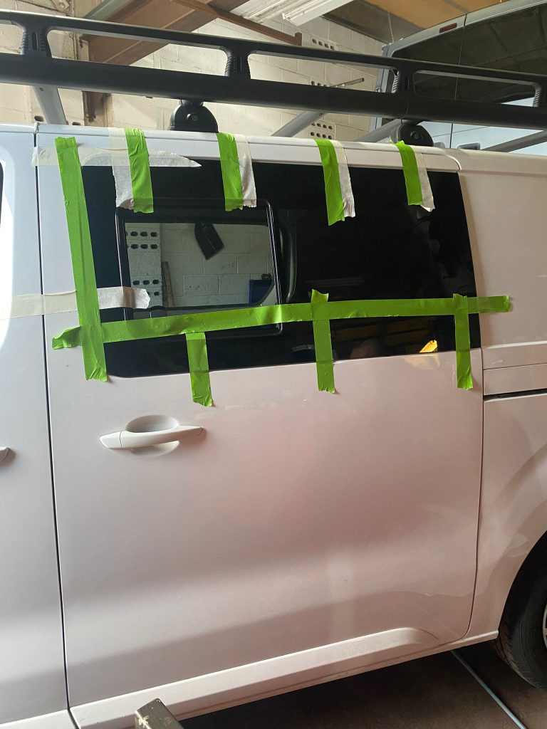 Side windows fitted to a Vauxhall Vivaro campervan conversion at Kinmel Campers