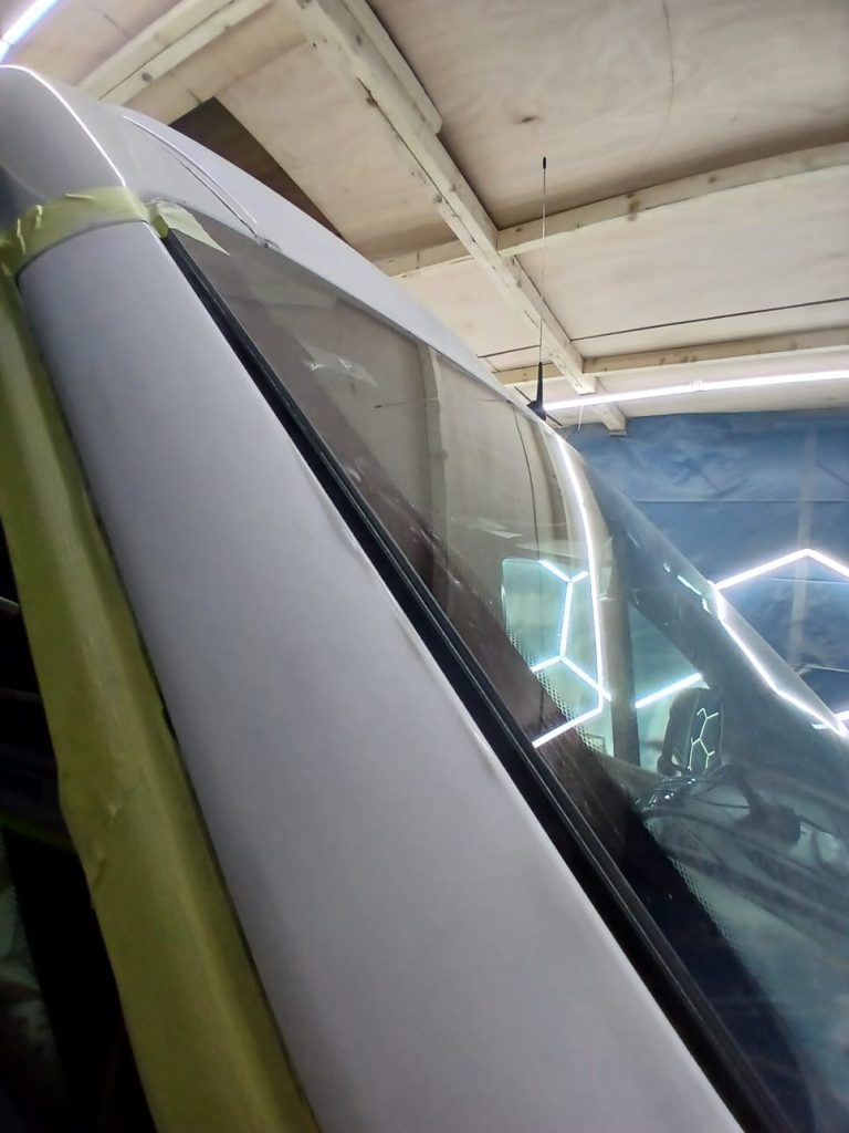 Citroën Relay undergoing full underseal treatment for rust protection at Kinmel Campers