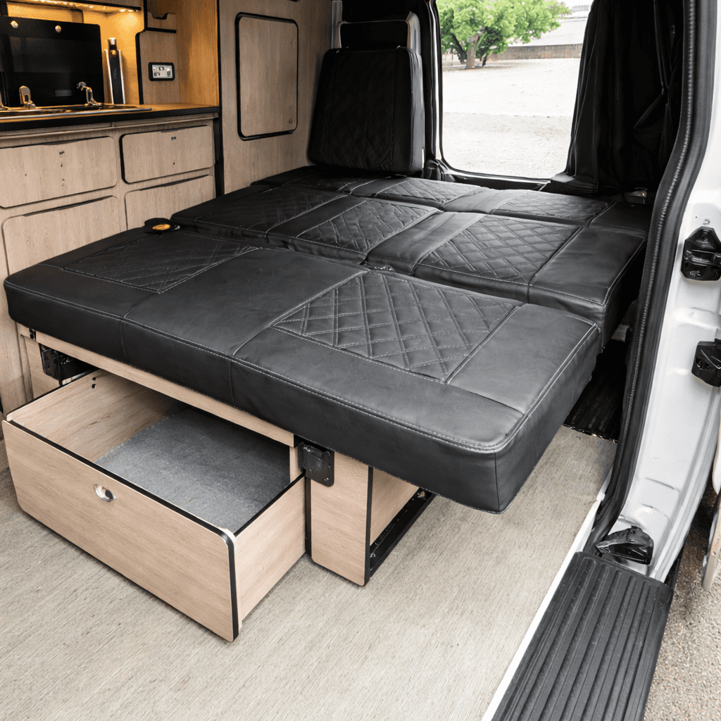 Citroen Dispatch campervan conversion rock and roll bed fully extended into sleeping position with under bed storage drawer