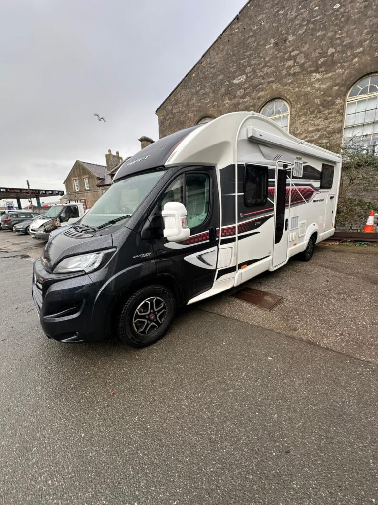 Full side profile of the 2022 Swift Kon-Tiki motorhome showing storage compartments and window layout