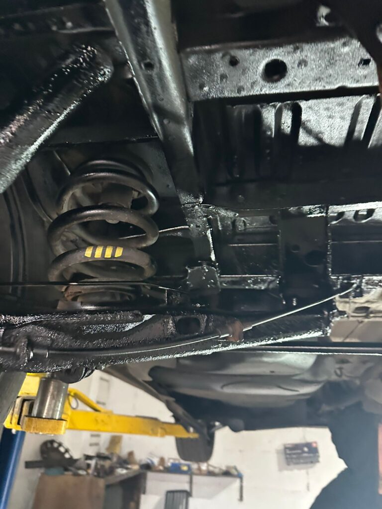 applying underseal coating to VW T5 chassis for corrosion protection