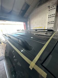 Volkswagen Caddy roof marked and taped for pop top installation preparation at Kinmel Campers workshop