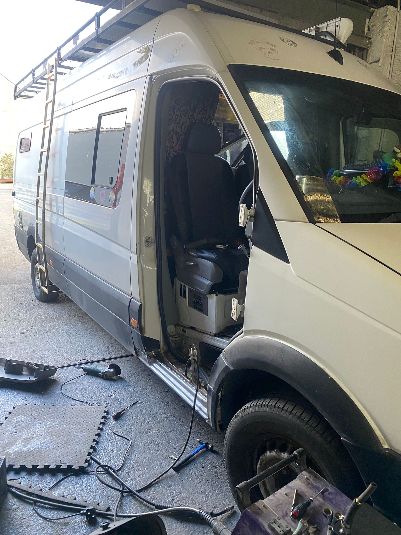 Full view of Volkswagen Crafter in workshop undergoing sill repair and welding restoration