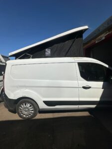 Ford Transit Connect pop top roof supplied and fitted by Kinmel Campers in North Wales showing completed campervan roof conversion