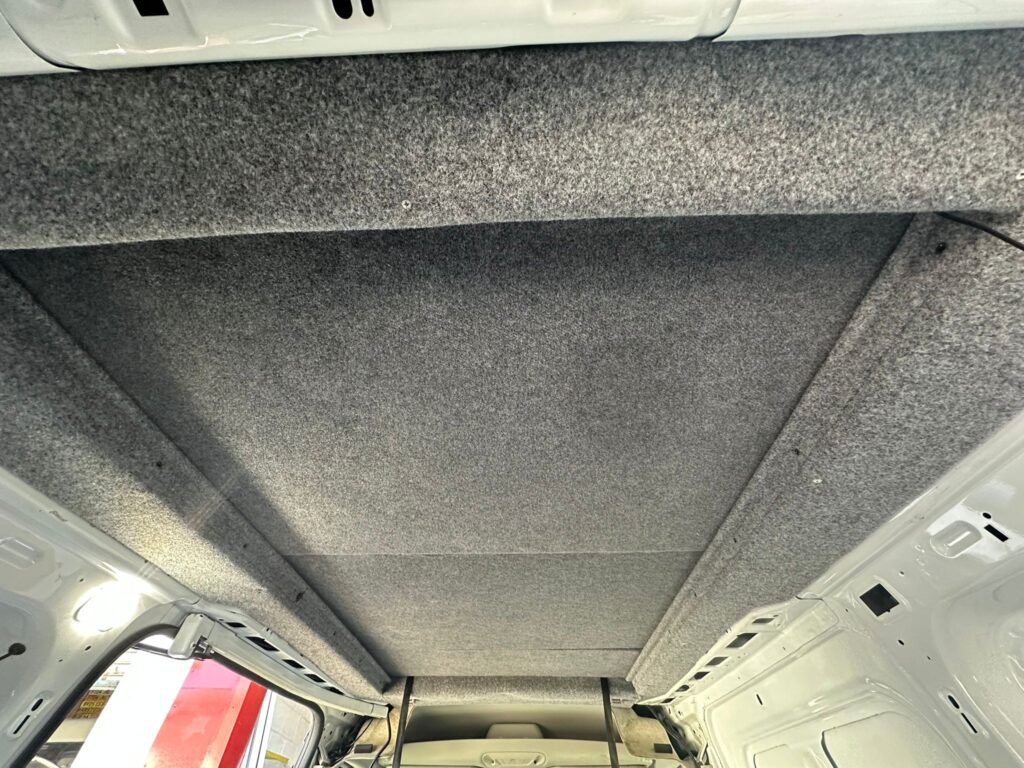 Professionally carpet lined Ford Transit Connect pop top roof frame finished by Kinmel Campers
