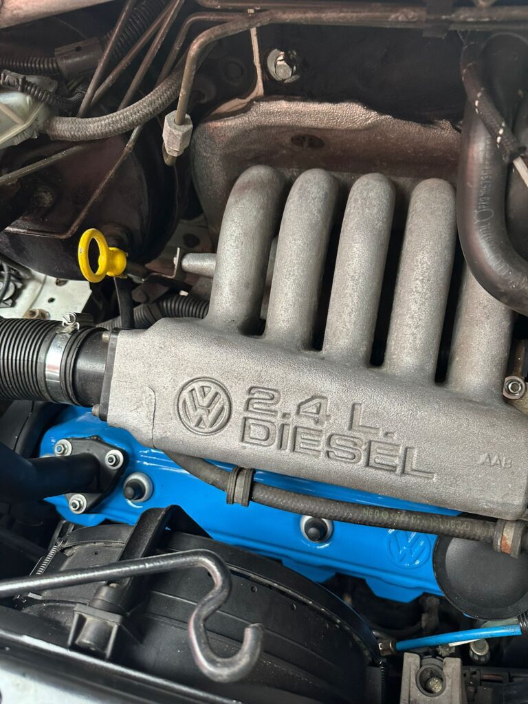 Close-up of VW T4 2.4 diesel engine during professional cam belt replacement service