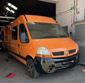 Bright orange campervan respray North Wales with gloss black trims after workshop repair